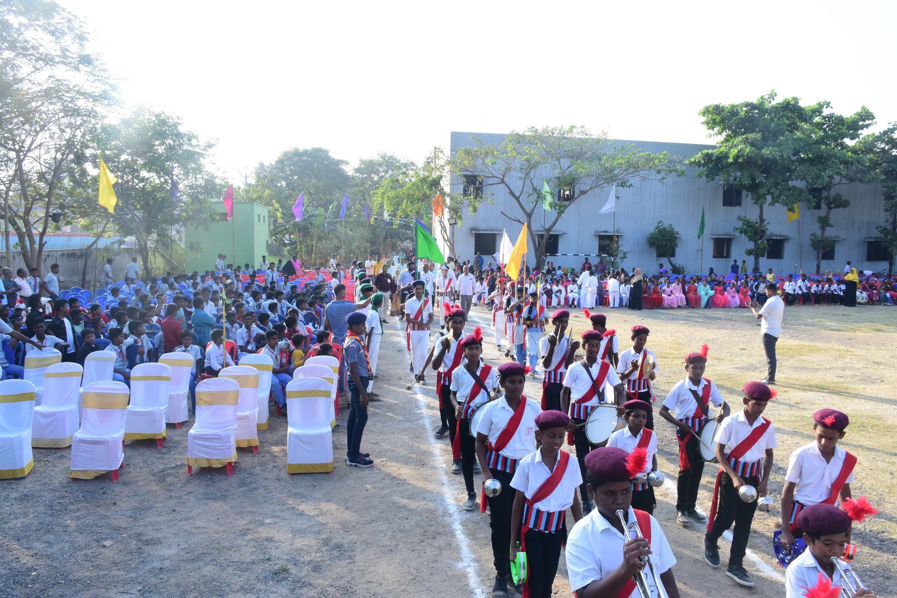 Students of the Husainy Schools march past at the annual sports day on the Husainabad campus
