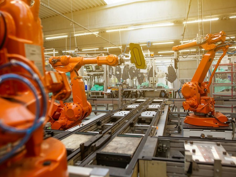 Industrial robot arms on a production line